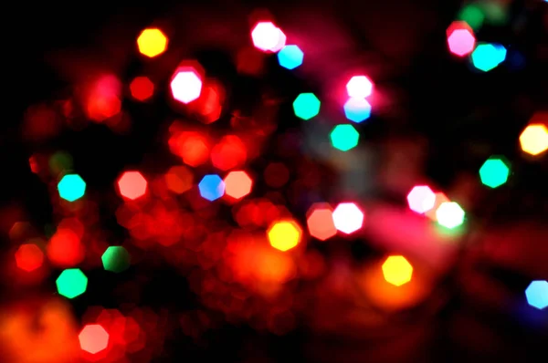 Christmas background.Glowing and festive colored light circles created from in camera
