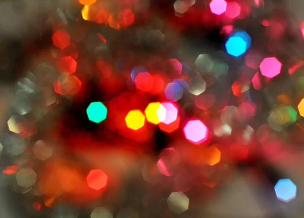Χριστουγεννιάτικο φόντο. Λαμπερές και εορταστικές χρωματιστές κύκλους που δημιουργήθηκαν από την κάμερα — Φωτογραφία Αρχείου