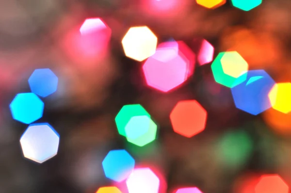 Christmas background.Glowing and festive colored light circles created from in camera