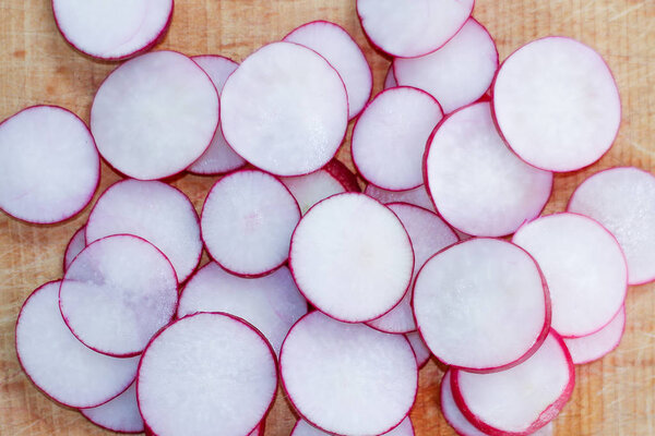 radish cut rings on a wooden Board. harvest