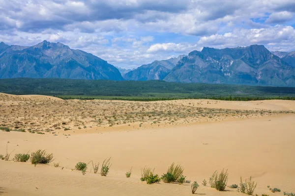 Chara sands and Mountains Kodar ridge in Eastern Siberia