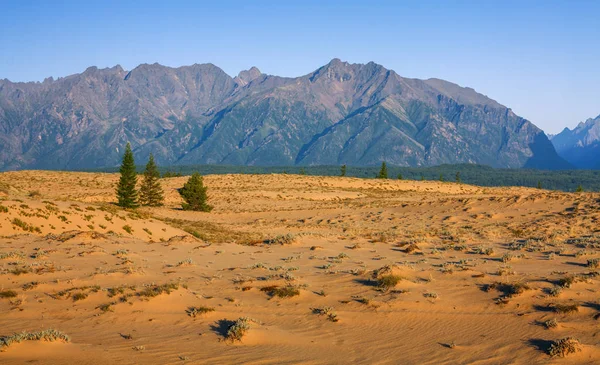 Chara sands and Mountains Kodar ridge in Eastern Siberia