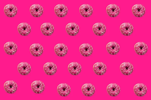Donuts on pink background. Sweets and food