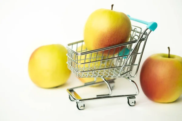 Fresh tasty apples in store carts. Concept for purchasing in the grocery shop