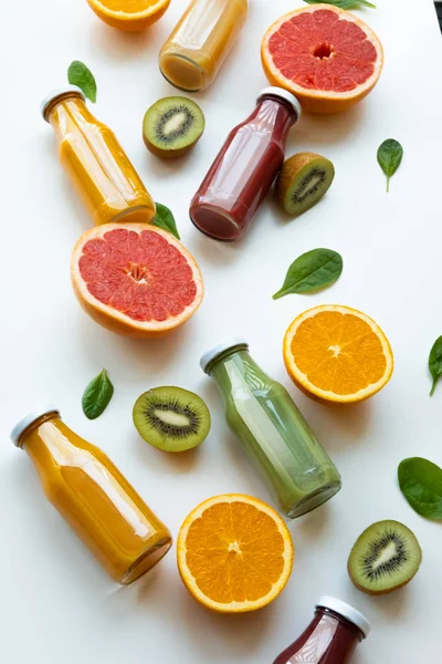 Different juices and fruits on white background. Healthy and fresh concept.