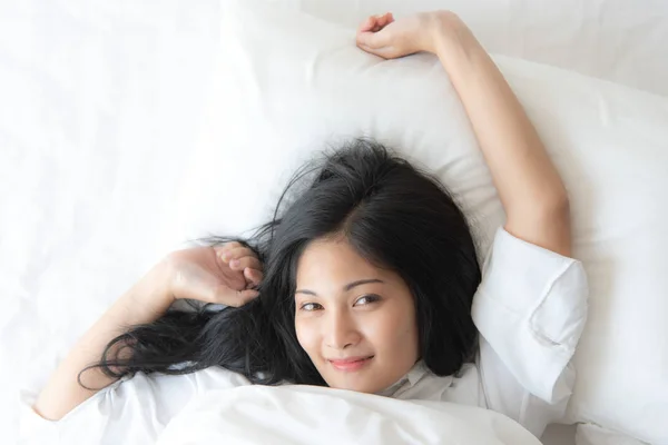 Cheerful Pretty Asian Woman Sleeping While Lying Bed Comfortably Blissfully Stock Photo