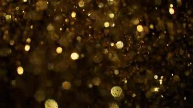 Parıldayan Altın Arkaplan 'ın Süper Yavaş Çekimi, 1000fps' de. Yüksek Hız Sinema Kamerası, 4K.