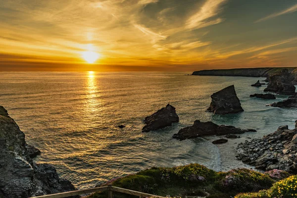 Beautiful dusk sunset of Bedruthan Steps rock stacks in Cornwall, UK Stock Photo