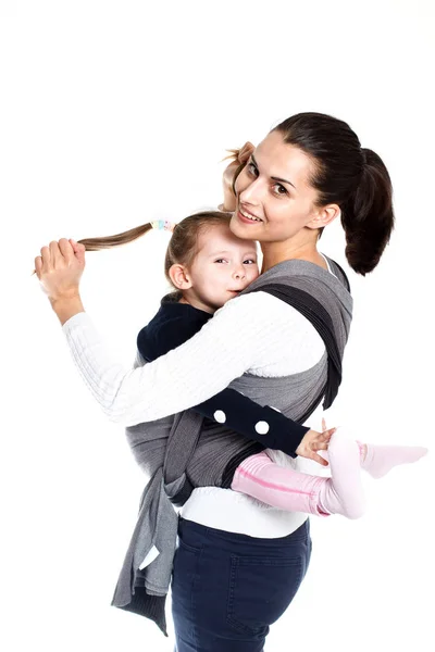 Mother and child wraped in woven baby carrier having fun together — Stock Photo, Image
