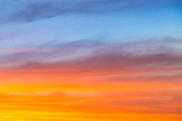 Amazing blue, orange and yellow colors sunset sky gradient background.