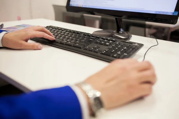 A man who operates a personal computer