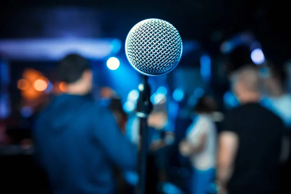 Microphone. Microphone close-up. A pub. Bar. A restaurant. Classical music. Music