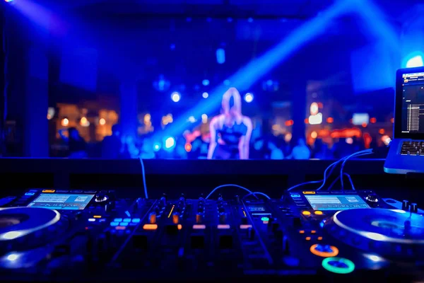 Dj playing the track in the nightclub at party closeup