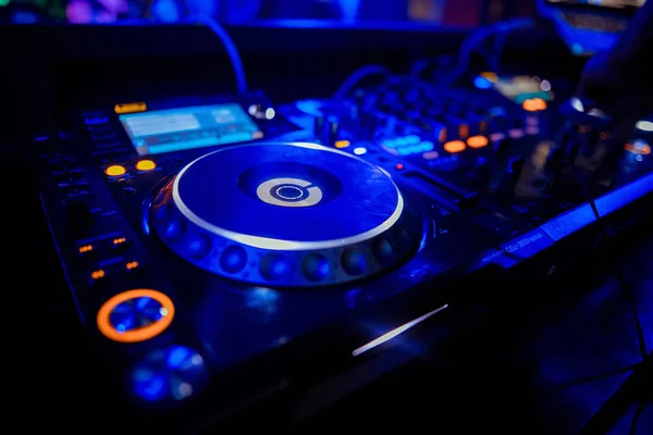 Dj playing the track in the nightclub at party closeup