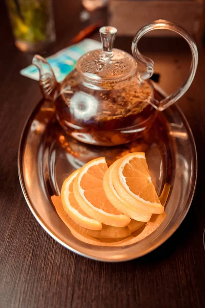 Red tea,brewed in a transparent teapot.Dry tea leaves