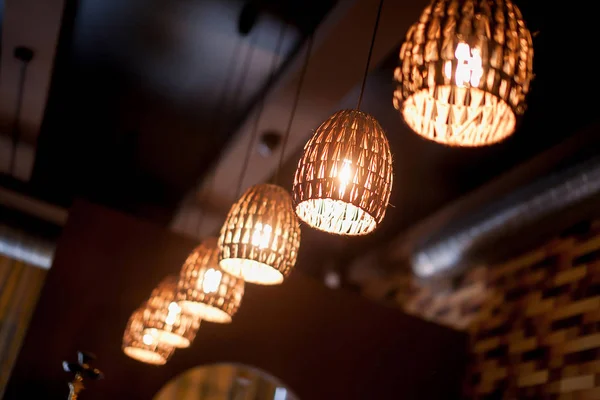 Warm lighting modern ceiling lamps in the cafe and interior decoration restaurant.