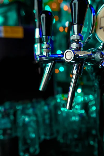 Beer taps in a pub. Close up of beer Tap. Selective focus.