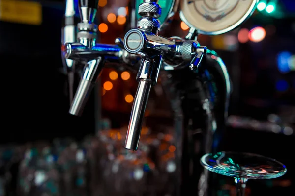 Beer taps in a pub. Close up of beer Tap. Selective focus.