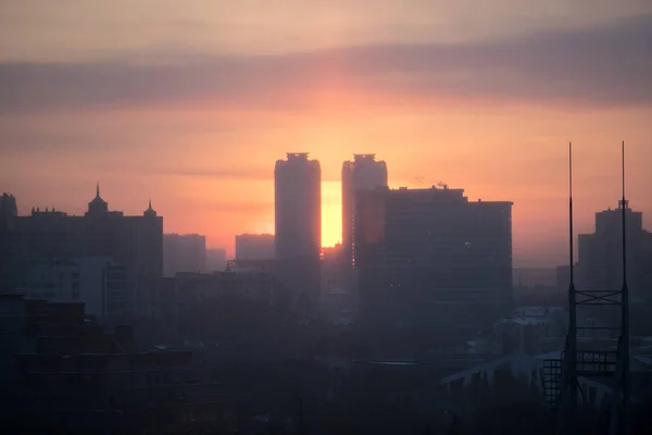 dawn in the city in smog