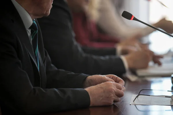 Press conference. Public speaker giving talk to Television camera. News ...