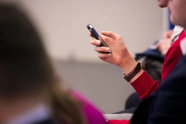 close up investor man hand gesture hold mobile phone device for reading or write digital content concept.