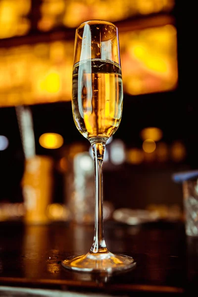 champagne in a glass against the background of the bar