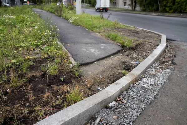 Repair of Ramps and sidewalks for the disabled. Renovation of the road. New asphalt pavement. Asphalt road repair. The details of the repair of asphalt roads.