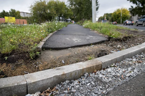 Repair of Ramps and sidewalks for the disabled. Renovation of the road. New asphalt pavement. Asphalt road repair. The details of the repair of asphalt roads.