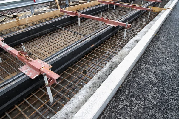 Repair of the railway tram line. Installation of new modern silent railway rails for trams. Laying of stone paving, road paving slabs on street. Repair of reconstruction of city roads with a tram line