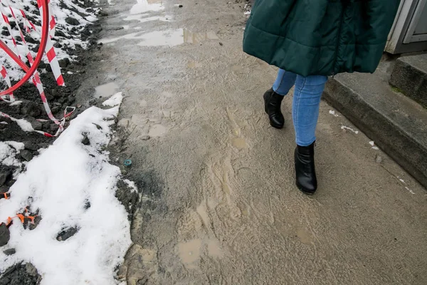 tile, pavement, dirt, snow, worker, stack, work, pedestrian, granite, asphalt, weather, cold, autumn, winter, spring, wet, puddle, step over, bypass, jump, wait, out of time, delay, contractor