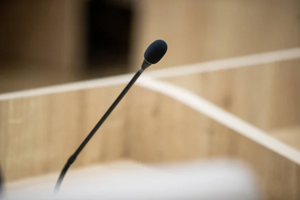 Desktop microphone without people. Conference room before meeting or session of government. Seminar meeting room before business event.