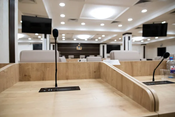 Desktop microphone without people. Conference room before meeting or session of government. Seminar meeting room before business event.