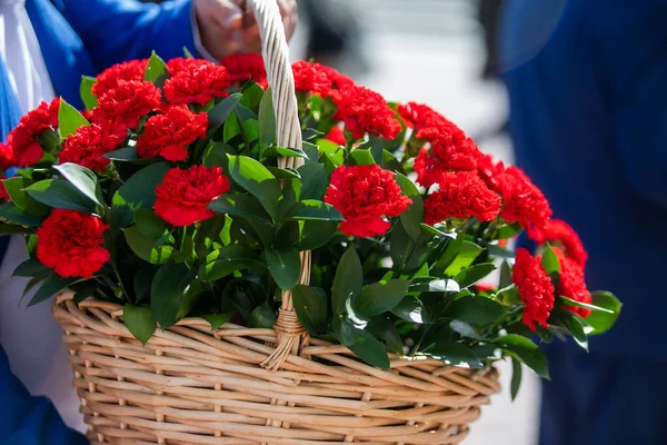 Flowers lie on a granite monument, laying flowers on the day of remembrance and mourning.