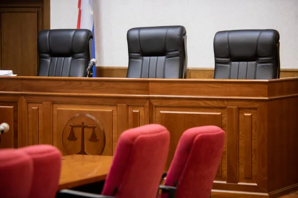 A courtroom in a Russian court, an empty judge\'s chair