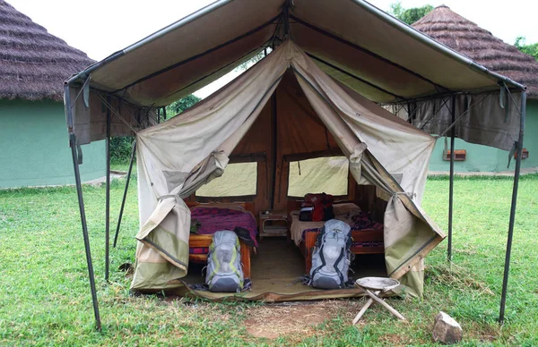 A basic canvas safari tent setup with two beds.