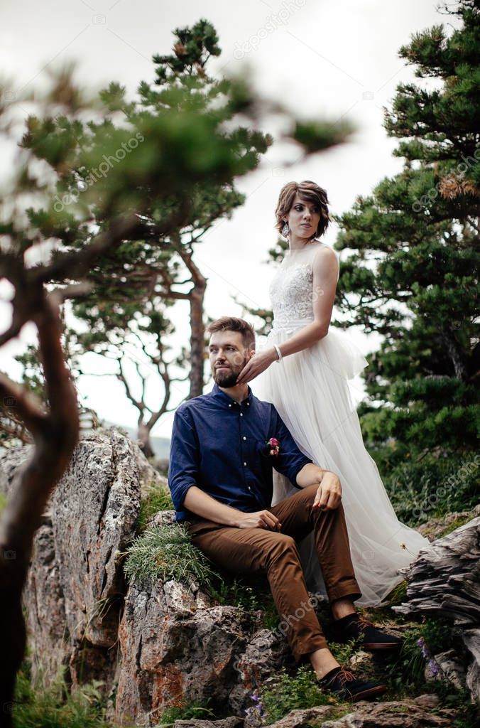 just married couple posing outdoors on their wedding photo - session