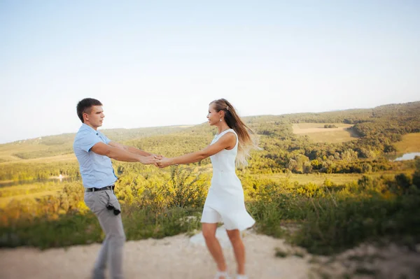 couple in love on a walk in the summer in the mountains