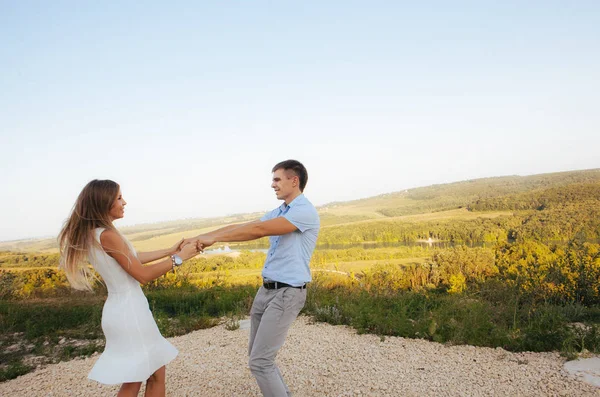 couple in love on a walk in the summer in the mountains