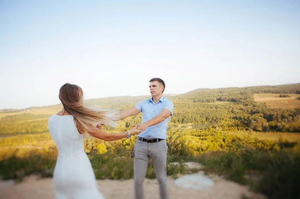 couple in love on a walk in the summer in the mountains