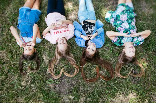 Hair Shape Heart Four Teen Girls Lying Grass Positive Schoolgirl — Stock Photo, Image