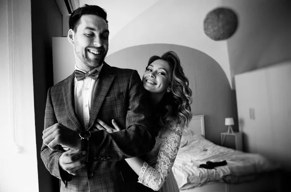 morning of the bride and groom in the bedroom, black and white photo