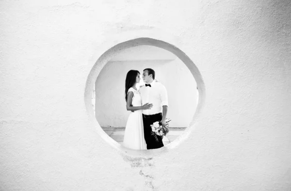 Happy young bride and groom. Black and white photo