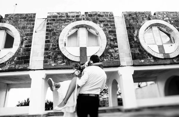 Happy young bride and groom. Black and white photo