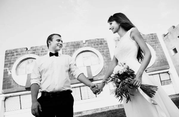 Happy young bride and groom. Black and white photo