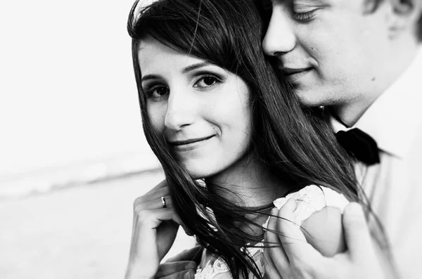 Happy young bride and groom. Black and white photo