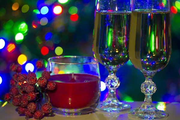 Holiday congratulatory photo with cristal glasses and lights — Stock Photo, Image