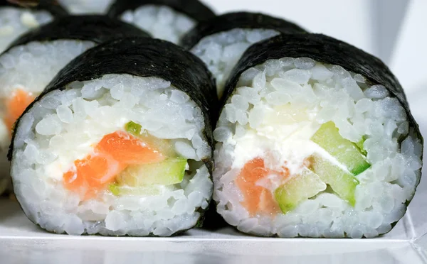 stock image maki with salmon rice cheese and cucumber