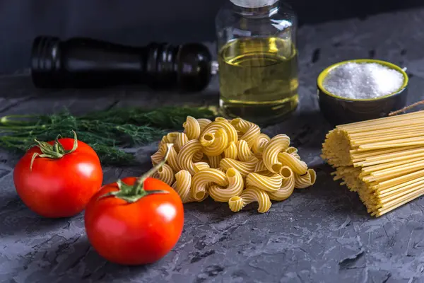 Uncooked Italian Pasta Cavatappi Spaghetti Ingredients Tomato Sauce Dark Background — Stock Photo, Image