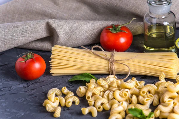 Uncooked Italian Pasta Cavatappi Spaghetti Ingredients Tomato Sauce Dark Background — Stock Photo, Image