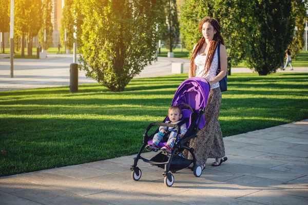 Young Modern Mom Baby Son Stroller Walking Sunny Park Concept — Stock Photo, Image